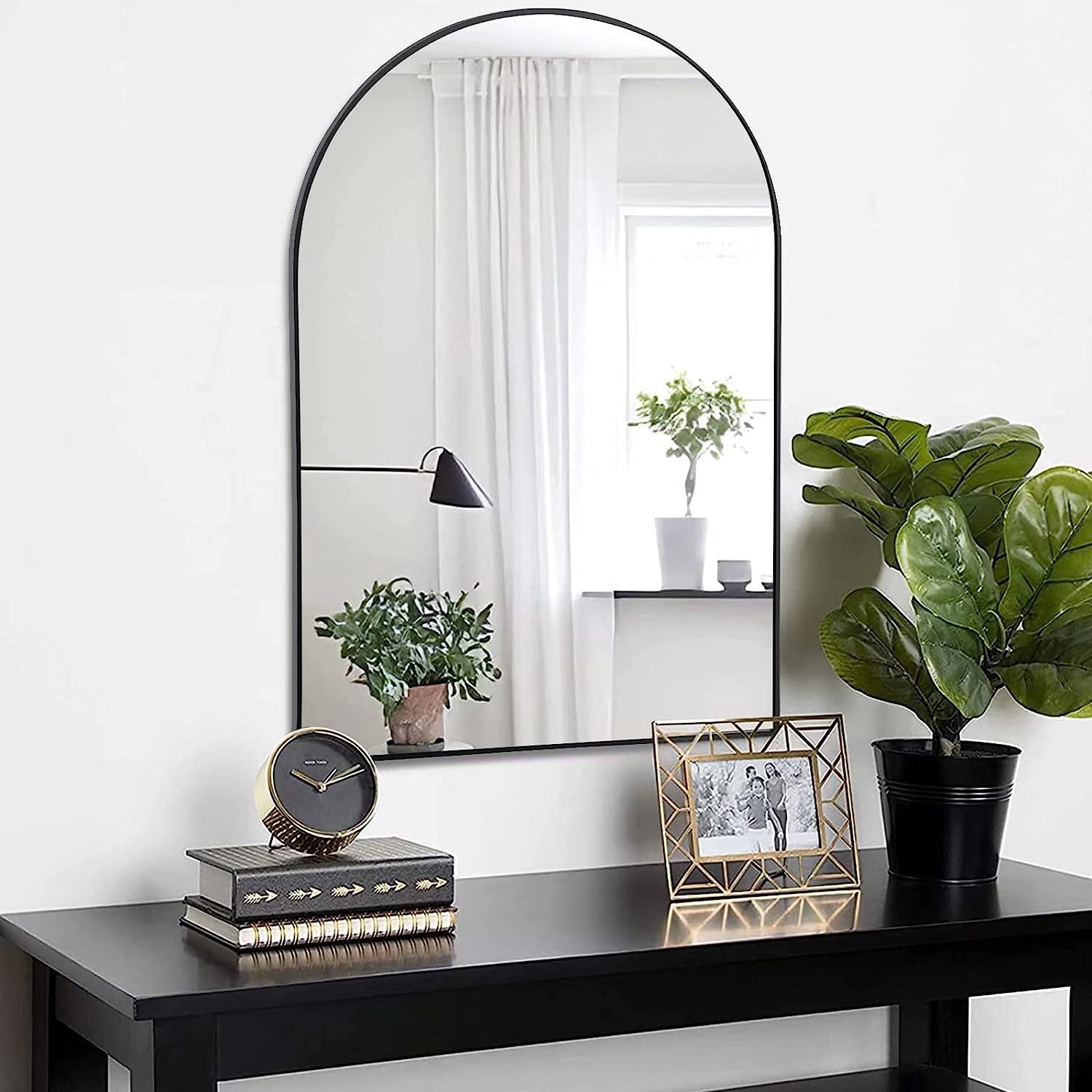 Arched black aluminum bathroom mirror measuring 20x30 inches with sleek, modern design by Anthony & Home.