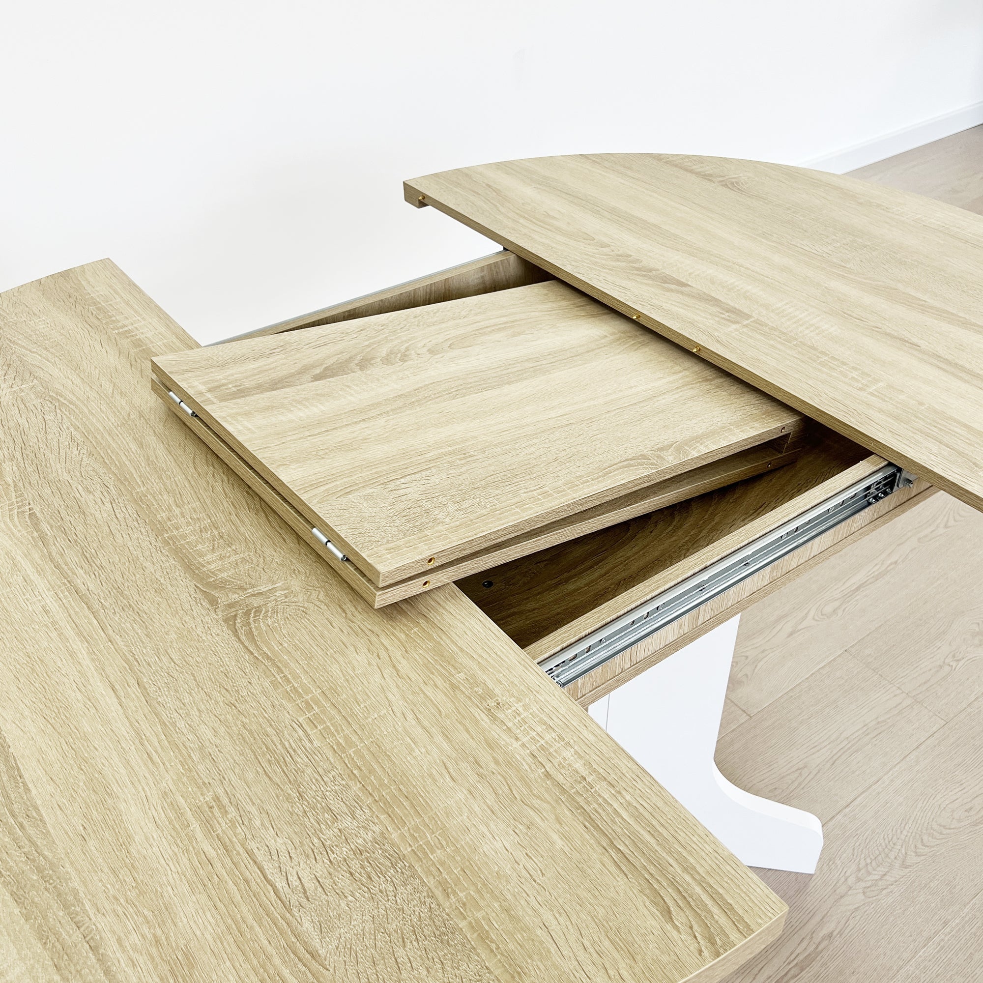 White Oak Edition oval dining table with expandable leaf by Anthony & Home, showcasing a stylish wooden surface and elegant design