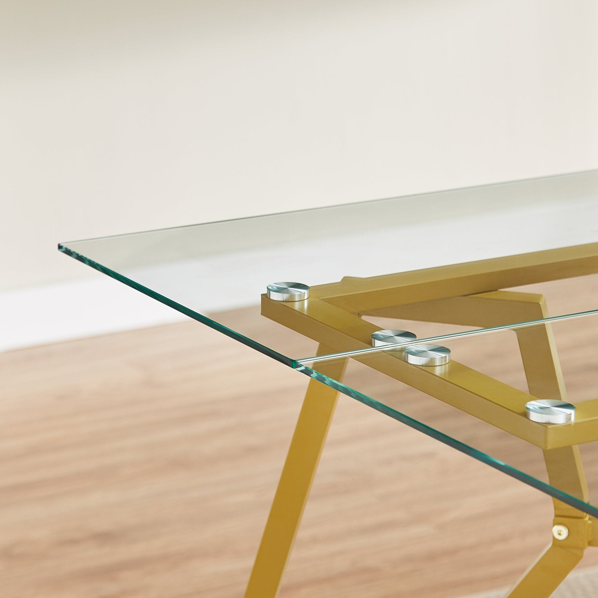 Rectangular glass dining table with gold finish from Anthony & Home's Atelier Collection, modern and elegant furniture piece.