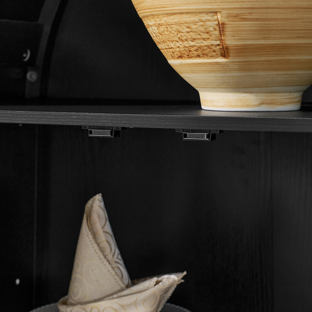Black arched lamp cabinet with glass partitions, stylish atelier design by Anthony & Home, showcasing modern home decor.