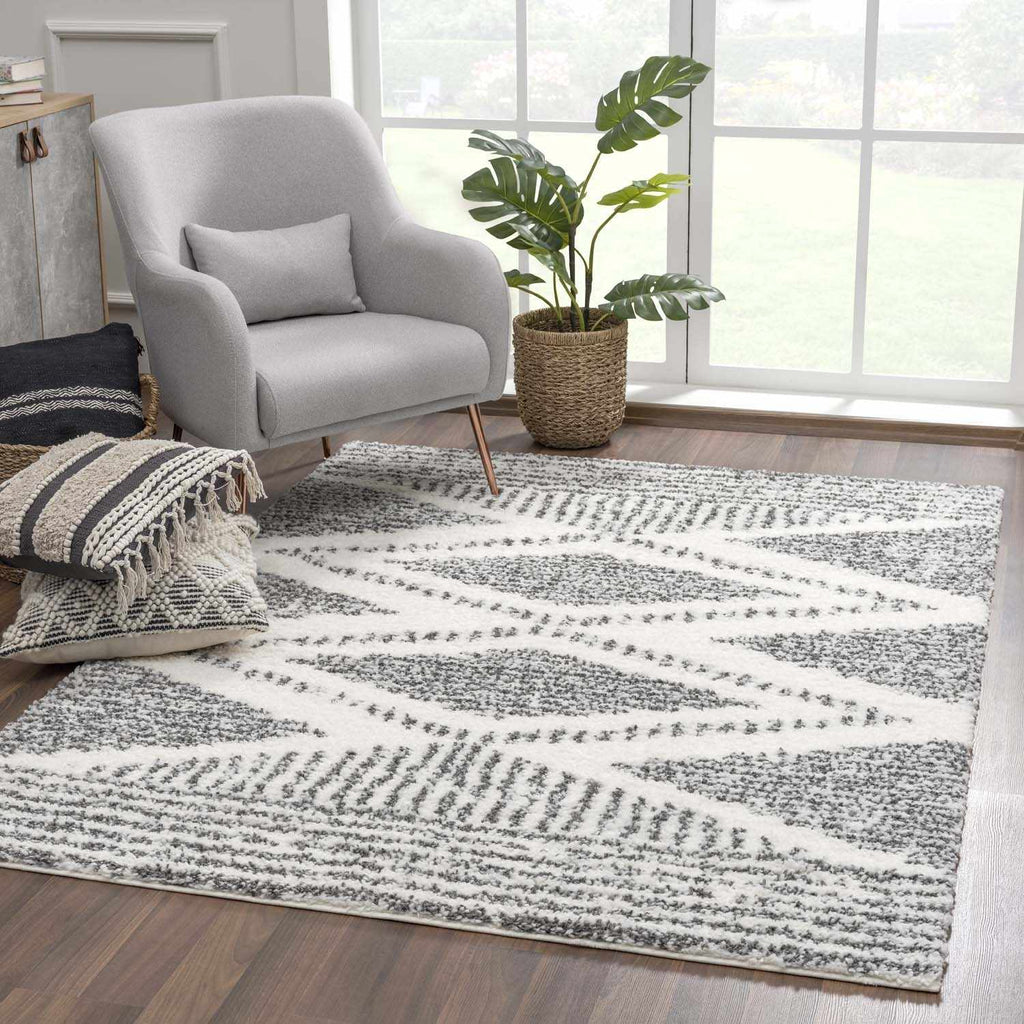 Moroccan Boho shag area rug by Hauteloom in a cozy room setting, showcasing its textured, plush design and earthy tones.
