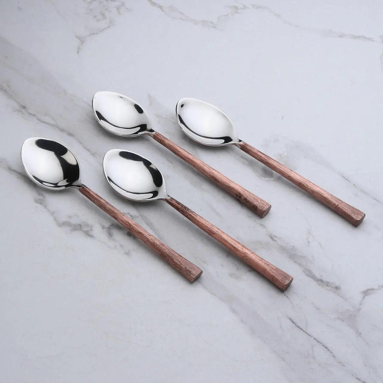 Set of four Sundance copper antique table spoons by INOX Artisans, featuring elegant ornate handles and polished finish.