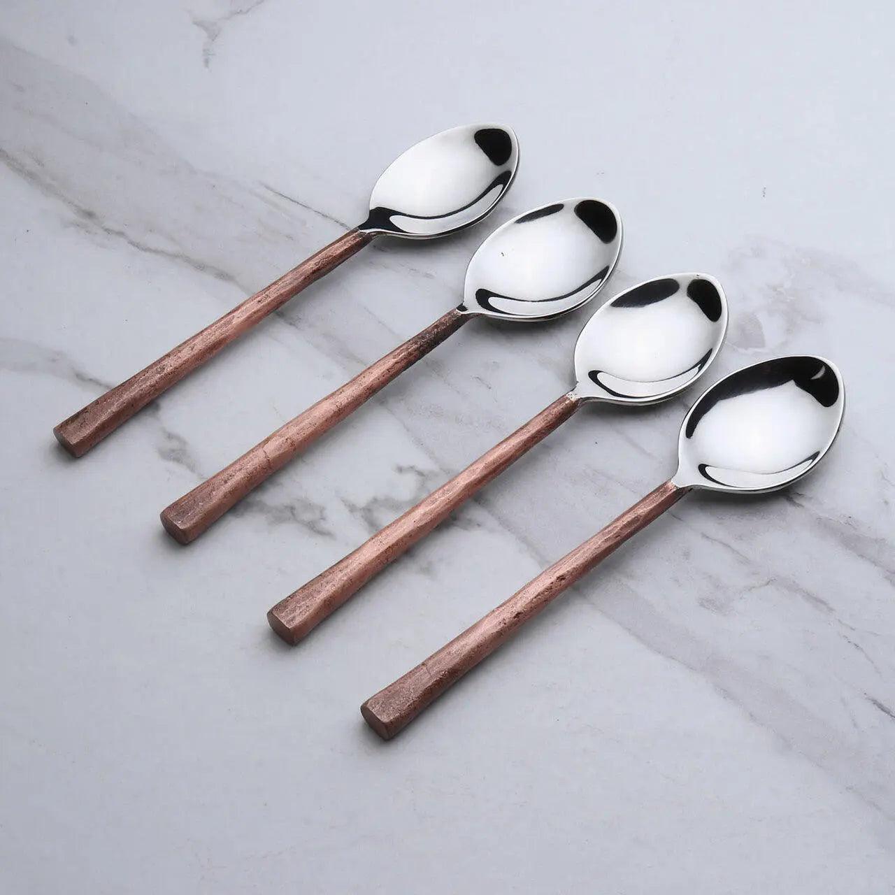 Set of four Sundance copper antique table spoons by INOX Artisans, featuring elegant, vintage-style design for dining and serving.